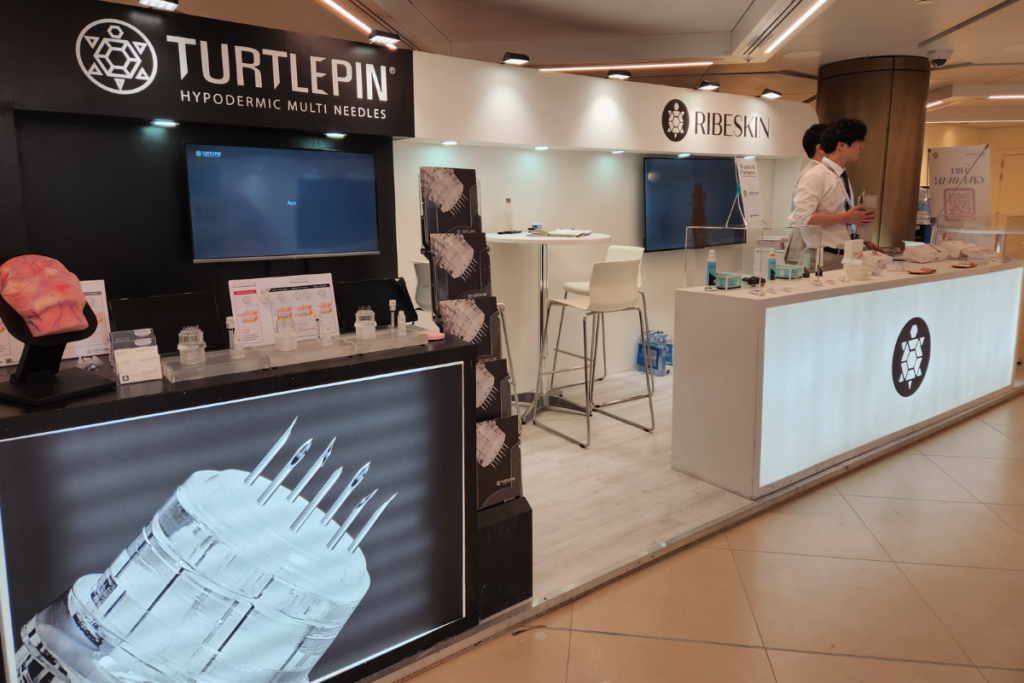 turtlepin multi needle device and ribeskin products on display at the AMWC 2024 booth in Monaco